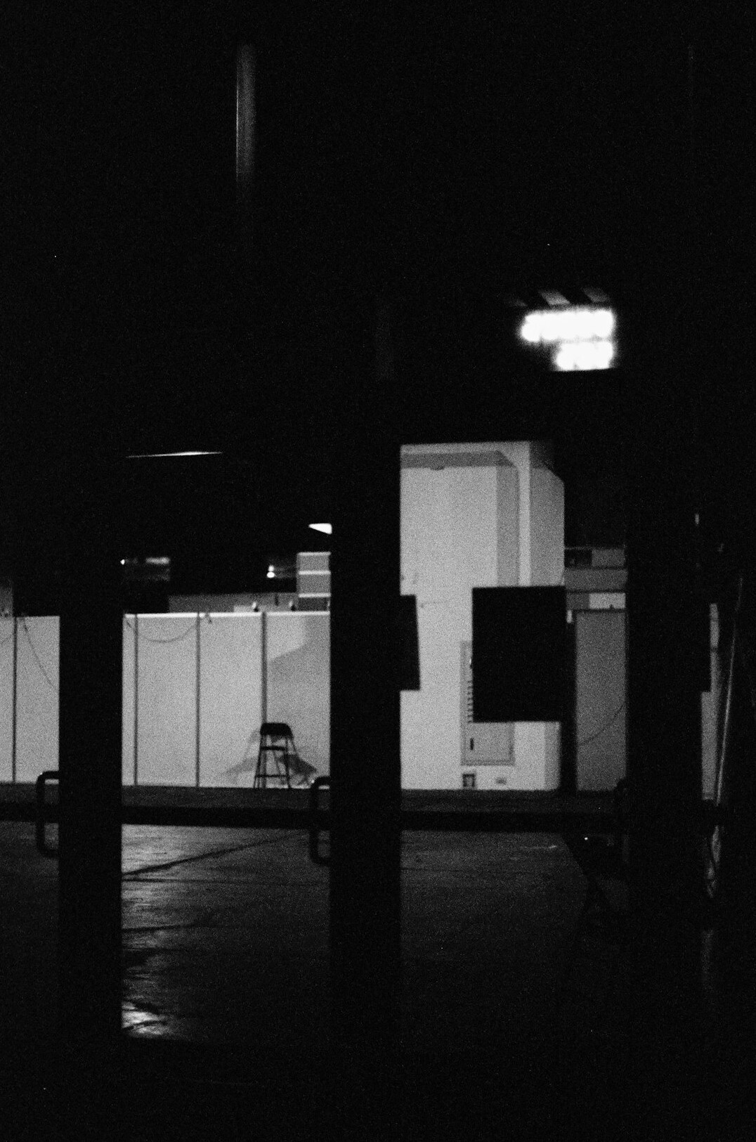 Television news studio with cameras on pedestals and lighting rig