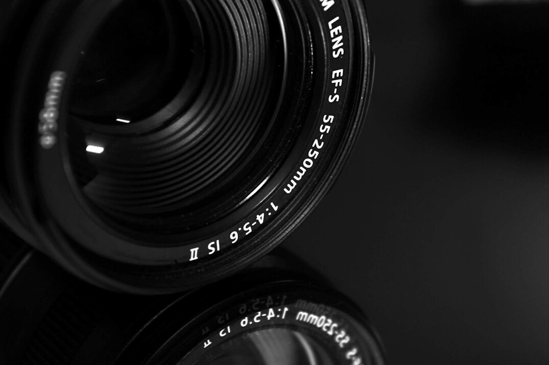 Close-up of a camera lens with reflections